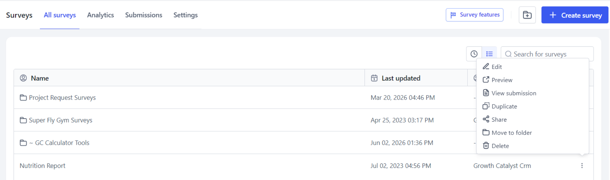 The Surveys dashboard, with the ellipsis menu open on a survey
