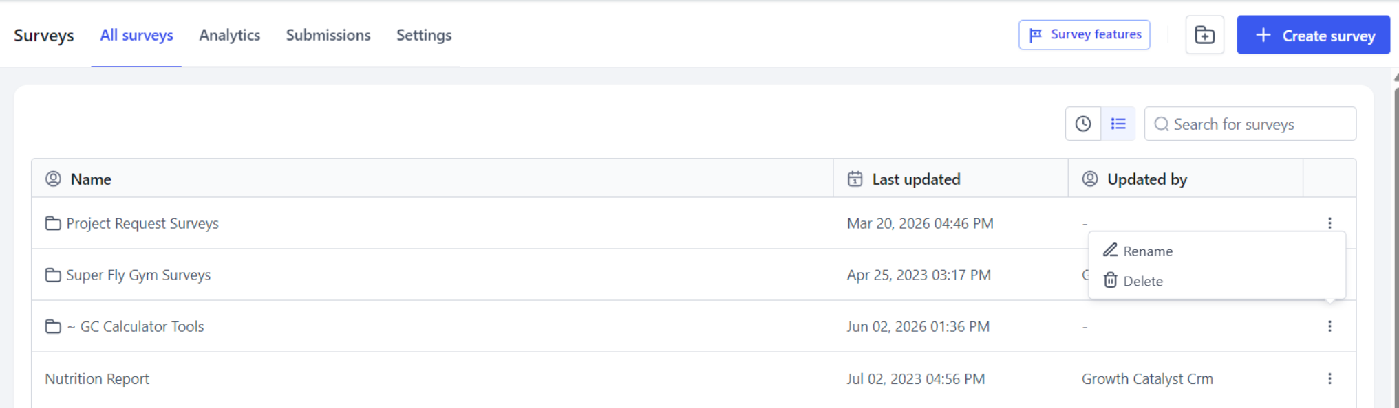 The Surveys dashboard, with the ellipsis menu open on a folder